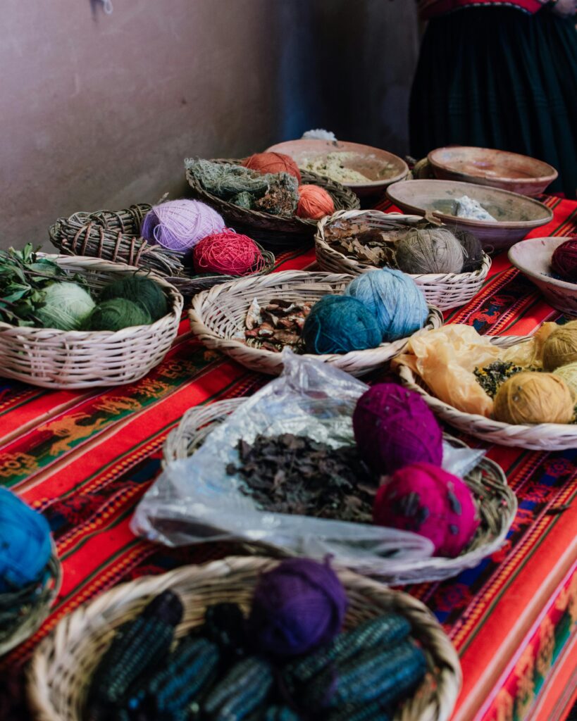 pexels-photo-33027862-33027862 Vibrant display of traditional Peruvian textiles and natural dyes at a market in Cusco.